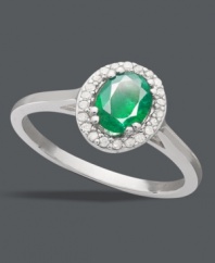 A subtle hint of color makes your whole look pop. This petite ring features an oval-cut emerald (3/4 ct. t.w.) surrounded by a halo of round-cut diamonds (1/10 ct. t.w.). Set in sterling silver. Size 7.