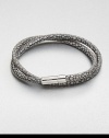 A double strand of fine Italian leather in a unique stingray pattern is offset by a sterling silver cylindrical clasp.LeatherSterling silverAbout 2½ diam.Made in the United Kingdom