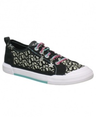 Get funky. She'll love breaking out of her everyday sneaker style with these animal-print slip-on shoes from Keds.