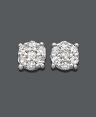 A modern twist on the traditional diamond earring. Seven, round-cut diamonds (1/10 ct. t.w.) cluster together to look like one in these stunning stud earrings. Crafted in 14k white gold. Approximate diameter: 4 mm.