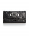 An everyday essential with an untamed edge. This glossy wallet by GUESS will keep your look on-point with a signature front plaque, silvertone hardware and sleek embossed crocodile print.