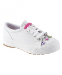 The clean, classic style of these darling Keds shoes kicks it up with fun charm lace keepers.