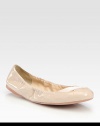 Patent leather scrunch ballet flats with criss-cross elastic detail. Patent leather upperLeather liningRubber solePadded insoleImportedOUR FIT MODEL RECOMMENDS ordering one half size up as this style runs small. 