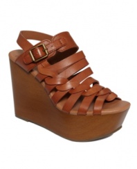 Weave a web of irresistible fashion. The Rosemary sandals by Lucky Brand are the ultimate accessory for feminine skirts and worn-in flares with their faux wood covered wedge and woven straps.