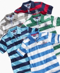 Variety of styles. He can choose the right color to match his look with this basic polo shirt from Tommy Hilfiger.