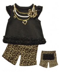 Go bold. Start her unique style early with this fun, ruffly shirt and short set from Baby Essentials.