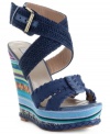 Here comes summer style. With an earthy, woven wraparound strap at the ankle and a sky-high wedge heel with braided trim at the bottom, the Surayya platform sandals by RACHEL Rachel Roy are decked out and ready for sun.