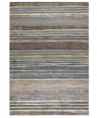 Variegated tones of bone, tan, silver, teal and sage are interwoven across this Taylor Vibrato area rug from Couristan, creating the ultimate floor accent for complementing industrial and mid-century decors. Wilton-woven for unparalleled depth, texture and quality.