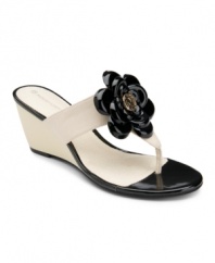 Rockport freshens up a classic summer slide with a beautiful bloom and logo charm at center of the lovely Nicoleen wedges.