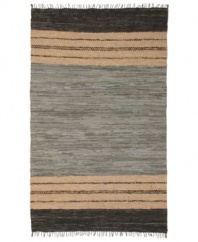 Olé! Spice up your decor with the gorgeously festive style of the Matador rug from St. Croix. Durable leather strips in elegant grey and cream hues are meticulously hand woven with fine cotton strands, resulting in a beautiful, rustic texture and natural braided pattern that accents even the most eclectic decor.