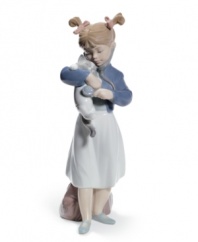 A young doctor prescribes lots of love and tummy rubs for her kitty in this adorable Lladro collectible, crafted of beautifully glazed porcelain.