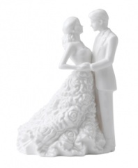 Something new for the stylish couple. A couture cake topper fashioned in white bone china offers a modern alternative to the traditional must-have. By Monique Lhuillier.