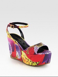 Vivacious floral-print canvas sandal in a platform wedge silhouette with a rubber sole and an adjustable ankle strap. Self-covered wedge, 4 (100mm)Covered platform, 2 (50mm)Compares to a 2 heel (50mm)Printed canvas upperLeather liningRubber solePadded insoleImportedOUR FIT MODEL RECOMMENDS ordering one half size up as this style runs small. 