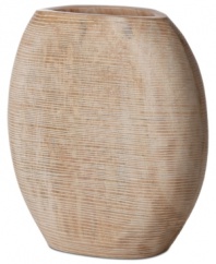 At once modern and organic in nature, the Light Carved vase is sculpted and carved by hand in honey-colored mango wood to achieve a distinct artisan feel. A uniquely bold statement by Donna Karan Lenox.