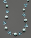 Beautiful blooms of round-cut blue topaz (33 ct. t.w.) alternate with larimer beads on this sterling silver necklace. Approximate length: 18 inches.