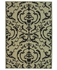 Safavieh takes classic beauty outside of the home with this elegant rug, created with a specially designed sisal weave. In eye-catching beige and black colorways, this engaging piece makes the most of any outdoor patio, porch or balcony. (Clearance)