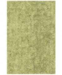 Add a pop of pure, shimmering green to any modern room with the Metallic area rug from Dalyn. Hand-tufted of soft polyester, this high-luster shag area rug puts comfort and fun back in floor decor.