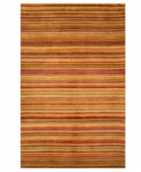 What's your line? This area rug from Liora Manne delivers a sea of stripes in beautiful sunset colors -- shades of red, orange and yellow that bring warmth to every corner of the room. Hand-tufted in India from 100% wool with a thick half-inch pile for a soft, gentle hand.