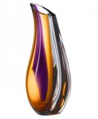 With the extraordinary beauty and grace of an orchid blossom, this Kosta Boda vase adds brilliant artistry to modern interiors. Luxurious art glass hand-crafted in an easy, fluid shape glistens with streaks of rich violet and warm amber.