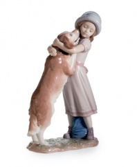 Puppy love. A friendly golden retriever greets his young owner with kisses in this charming, must-have collectible for any pet owner. From Lladro.