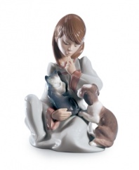 Kitten and puppy vie for attention and a warm lap from their loving owner in the Cat Nap figurine. She's ready for bed too, wearing a long nightgown. From Lladro.