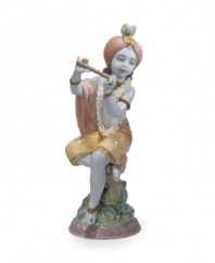 Depicted as a young child, Lord Krishna practices the flute in this elaborately detailed, beautifully handcrafted porcelain figurine from Lladro.