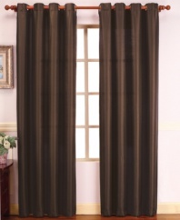 Simple yet stylish, these solid faux silk window panels make a lavish statement in any room. Distinctive hues, each with a subtle sheen, exude a decidedly luxe appeal, imparting a sense of refinement and sophistication. Polyester.
