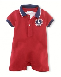 A preppy short-sleeved polo shortall in breathable stretch cotton mesh is accented with USA patching, celebrating Team USA's participation in the 2012 Olympics.