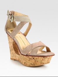 Stacked cutout wedge adds an architectural aesthetic to suede criss-cross straps with an adjustable ankle strap. Stacked cutout wedge, 4 (100mm)Stacked platform, 1 (25mm)Compares to a 3 heel (75mm)Suede upperLeather lining and solePadded insoleImported