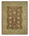 Alluring arabesques weave an inspiring design on this earth-toned area rug from Safavieh. Tufted in India from pure wool, this rug emerges from the annals of antiquity to bring spectacular style and time-honored quality to your home. (Clearance)