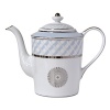 Carefully rendered in a style reminiscent of neoclassic trompe l'oeil-a French term for artwork that depicts optical illusions-a captivating geometric rosette motif traverses this elegant porcelain coffee pot from Bernardaud. Delicate shades of ice blue, mother-of-pearl and gray are enhanced by a fine platinum trim and medallion design.