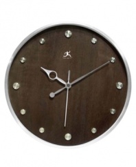 Make time for style with this handsome wall clock. A round wood grain dial with silver hour markers and metal hands adds contemporary flair to any room.