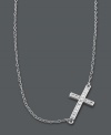A modern update on the traditional cross. Studio Silver adds a simple twist by turning a symbolic cross pendant on its side. Crafted in sterling silver with sparkling crystal accents and rhodium plating to prevent tarnishing. Approximate length: 16 inches + 2-inch extender. Approximate drop: 1/2 inch.
