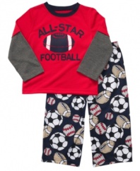 Sports star. He can dream of the big game with this sleepwear set from Carter's, with a layered tee and cozy pajama pants.
