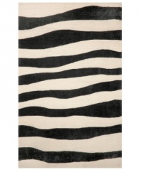 A suggested zebra stripe adds a hint of wild energy to the Spello Wavey Stripe area rug, while its tame color palette lends itself to any modern home décor. This unique home accent is intricately hand-tufted for crafted durability and supreme detailing in composition.