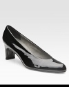 Traditional patent leather design has a high-cut vamp that hugs the foot and ultrasuede lining that provides comfort. Self-covered heel, 2¼ (60mm) Patent leather upper Ultrasuede lining Leather sole Padded insole Imported
