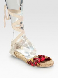 Stretchy linen upper in a classic print, topped with textured hemp and grosgrain ribbon that ties up the calf. Grosgrain ribbon, printed linen and hemp upperHemp liningRubber soleImportedOUR FIT MODEL RECOMMENDS ordering true whole size; ½ sizes should order the next whole size down. 