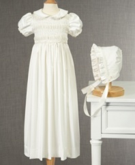 Pretty as a picture. Dress her in this beautiful smocked christening gown and bonnet from Cherish the Moment for memories that will last long after the day is over.