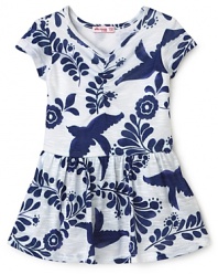 With its interlocking bird pattern and soft ruffled hem, this lovely bodysuit dress from Little Ella brings her summer look into focus.