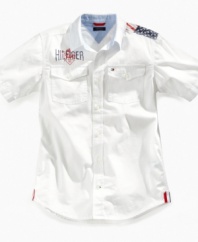Old glory. He'll stand out in this shirt from Tommy Hilfiger, with American flag graphic to complement his sharp look.