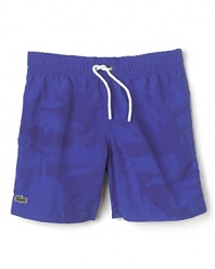 The suit he'll always remember: get these amazing Lacoste swim trunks wet and the alligator logo appears.