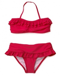 Charming ruffles on the top and bottom doll up this fun bikini for all her trips to the shore.