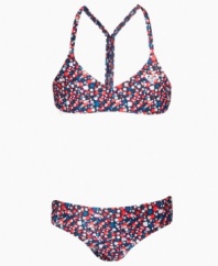 Flower power. The fun flower print decorating this two-piece swimsuit from Roxy is perfect for hitting the surf or relaxing on the sand.
