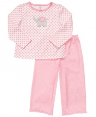 Your princess can snuggle up in a style that's both cozy and pretty with this pajama shirt and pants set from Carter's.