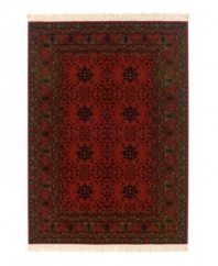 An extravagant bed of roses, this rug is ideal for larger rooms. Kashimar Nomad Red rugs' ornate, symmetrical designs set against deep, right reds give an air of prosperity to any room. Woven of the finest 100% New Zealand semi-worsted wool, this high-quality wool creates a dense, lustrous feel while Couristan's locked-in-weave power-loom construction secures each individual strand of yarn into an upright position creating their exclusive crystal-point finish. Hand-knotted fringe. 25-year limited warranty (defects due to manufacturing).
