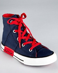 Criss cross topstitching and clever contrast accents update Converse' classic high top sneaker for the 21st century.