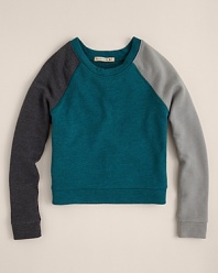 The raglan sleeves and the complimentary colorblock pattern adds warmth to this 80s-inspired pullover from ALTERNATIVE.
