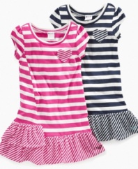 Near and dear. The pocket on this striped ruffle dress from Roxy lets her keep her most valuable possessions close to her heart.