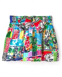 Juicy's tribute to the jet-setting girl, this brightly printed skirt depicts the sun, surf and fun of your favorite resort.