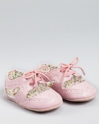 Somewhere between a sneaker and a sandal lies this adorable wing tip-inspired sneaker from Juicy Couture. The cute cut-outs reveal the floral lining.